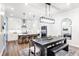 Open-concept kitchen and dining area with modern lighting and stylish decor at 418 Townly, Alpharetta, GA 30009