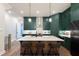 Kitchen boasts large island, stainless appliances, and green cabinets at 418 Townly, Alpharetta, GA 30009