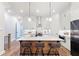 Bright, modern kitchen featuring white cabinets, a large island, and stainless steel appliances at 418 Townly, Alpharetta, GA 30009