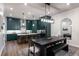 Modern kitchen and dining area with dark wood table and large island at 418 Townly, Alpharetta, GA 30009