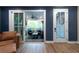 Open living room featuring hardwood floors, leading to an outdoor patio at 418 Townly, Alpharetta, GA 30009