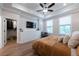Serene bedroom with natural light, hardwood floors, and a walk-in closet at 418 Townly, Alpharetta, GA 30009