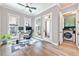 Bright home office with wood floors, ceiling fan, and a convenient laundry closet at 418 Townly, Alpharetta, GA 30009