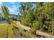 Winding community path with manicured landscaping and mature trees at 418 Townly, Alpharetta, GA 30009