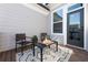 Cozy patio with outdoor seating, a black metal table, and an area rug at 418 Townly, Alpharetta, GA 30009