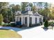 Charming pool house with brick accents, surrounded by well-manicured landscaping at 418 Townly, Alpharetta, GA 30009