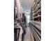 Well-organized walk-in closet with built-in shelving and hanging rods for clothing and shoe storage at 418 Townly, Alpharetta, GA 30009