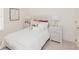 Cozy bedroom with white bedding, nightstands, and soft carpet at 1621 Aiden Way # 57, Conyers, GA 30013