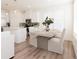 Bright dining area features a modern table set and view of the kitchen with stainless steel appliances at 1621 Aiden Way # 57, Conyers, GA 30013