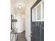 Welcoming entryway features modern lighting, stylish console table, and a sleek mirror at 1621 Aiden Way # 57, Conyers, GA 30013