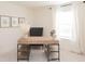 Home office with built-in shelving and large window with natural light at 1621 Aiden Way # 57, Conyers, GA 30013