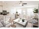 Bright and airy living room featuring modern decor, stylish furniture, and a ceiling fan at 1621 Aiden Way # 57, Conyers, GA 30013