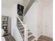 Modern staircase with black metal balusters and light wood steps at 1621 Aiden Way # 57, Conyers, GA 30013