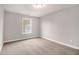 Bedroom featuring neutral paint, a carpeted floor, a window, and ample space at 692 Rose Palm Ln, Atlanta, GA 30315