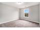 Bedroom featuring neutral paint, a carpeted floor, and a window with a view at 692 Rose Palm Ln, Atlanta, GA 30315