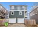 Two-story home with a two-car garage and attractive siding, surrounded by a wooden fence at 692 Rose Palm Ln, Atlanta, GA 30315