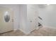 Bright foyer with a decorative front door and tile flooring, leading to an open staircase at 692 Rose Palm Ln, Atlanta, GA 30315