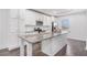 Modern kitchen with a large island, granite countertops, stainless steel appliances, and ample cabinet space at 692 Rose Palm Ln, Atlanta, GA 30315