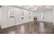 Spacious living room with dark hardwood floors, a coffered ceiling, and a cozy fireplace at 692 Rose Palm Ln, Atlanta, GA 30315