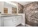 Bathroom featuring a walk-in shower with gray marble tile surround, granite countertop and vanity at 692 Rose Palm Ln, Atlanta, GA 30315