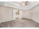 Expansive main bedroom with carpeted floor, connecting to the main bath through double doors at 692 Rose Palm Ln, Atlanta, GA 30315
