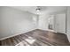 Bedroom featuring hardwood floors, a window, and access to the ensuite bathroom at 1506 Country Ct, Auburn, GA 30011