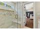 Stylish bathroom features a walk-in shower and a glimpse of the charming bedroom at 327 Balaban Cir, Woodstock, GA 30188