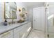 Elegant bathroom featuring double vanity and marble countertops at 327 Balaban Cir, Woodstock, GA 30188