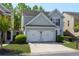 Well-maintained home with a two-car garage and manicured lawn in a friendly neighborhood at 327 Balaban Cir, Woodstock, GA 30188