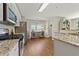 Well-lit kitchen with modern appliances, granite countertops, and ample cabinet space at 327 Balaban Cir, Woodstock, GA 30188