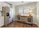 The kitchen area features stainless steel appliances, including a large refrigerator, and a vintage style cabinet at 327 Balaban Cir, Woodstock, GA 30188