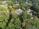 An aerial view showcasing a home nestled in a wooded area at 4395 Woodland Brook Se Dr, Atlanta, GA 30339