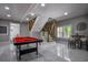 Basement featuring a pool table and a modern stairway leading to the upper floor at 4395 Woodland Brook Se Dr, Atlanta, GA 30339