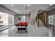 Basement area featuring a pool table, modern stairway, and kitchenette area at 4395 Woodland Brook Se Dr, Atlanta, GA 30339