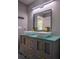 Modern bathroom featuring double vanity, glass countertop, and matte gold hardware at 4395 Woodland Brook Se Dr, Atlanta, GA 30339