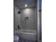 Bathroom with a glass-enclosed shower with white marble at 4395 Woodland Brook Se Dr, Atlanta, GA 30339