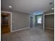 A spacious bedroom with neutral colored carpet and walls with recessed lighting at 4395 Woodland Brook Se Dr, Atlanta, GA 30339