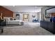 Spacious main bedroom suite featuring hardwood accent wall, stylish ensuite bathroom, and modern furnishings at 4395 Woodland Brook Se Dr, Atlanta, GA 30339