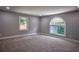Spacious carpeted bedroom with bright windows offering natural light and neutral colors at 4395 Woodland Brook Se Dr, Atlanta, GA 30339