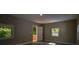 Bonus room with modern wood floors, three windows, and back yard access at 4395 Woodland Brook Se Dr, Atlanta, GA 30339