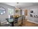 Elegant dining room features modern lighting fixture, a contemporary table, and stylish decor elements at 4395 Woodland Brook Se Dr, Atlanta, GA 30339