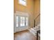 Welcoming entryway features a light-filled foyer, elegant hardwood floors, and staircase with modern railings at 4395 Woodland Brook Se Dr, Atlanta, GA 30339