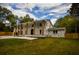 Impressive home features a brick facade, stately columns, and a well-maintained lawn at 4395 Woodland Brook Se Dr, Atlanta, GA 30339