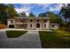 Stately two-story home with a brick facade, prominent columns, and a spacious driveway at 4395 Woodland Brook Se Dr, Atlanta, GA 30339