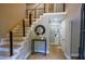 Inviting foyer features modern staircase and decor at 4395 Woodland Brook Se Dr, Atlanta, GA 30339