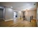 Spacious upstairs hallway with hardwood floors, modern railing, and stylish lighting at 4395 Woodland Brook Se Dr, Atlanta, GA 30339
