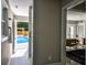 Hallway with a view of the pool through an open door and a cozy seating area in the distance at 4395 Woodland Brook Se Dr, Atlanta, GA 30339