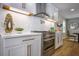 Bright kitchen featuring white cabinets, stainless steel appliances, and modern countertops at 4395 Woodland Brook Se Dr, Atlanta, GA 30339