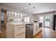 Contemporary kitchen with stainless steel appliances, white cabinetry, and quartz countertops for a sleek look at 4395 Woodland Brook Se Dr, Atlanta, GA 30339