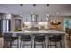 Bright kitchen features quartz countertops, modern lighting, and stainless steel appliances, perfect for cooking at 4395 Woodland Brook Se Dr, Atlanta, GA 30339